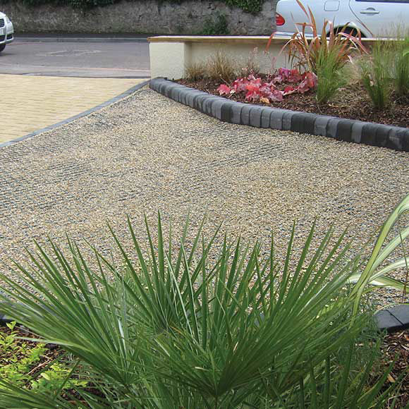 grass ground guard for gravel pathways